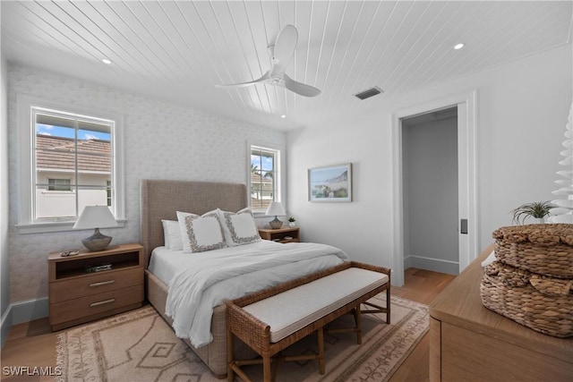 bedroom featuring ceiling fan, wooden ceiling, and light hardwood / wood-style floors