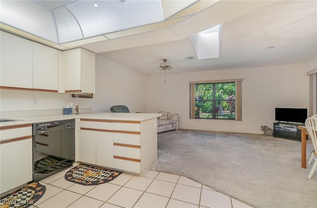 kitchen featuring white cabinetry, dishwasher, ceiling fan, kitchen peninsula, and light carpet