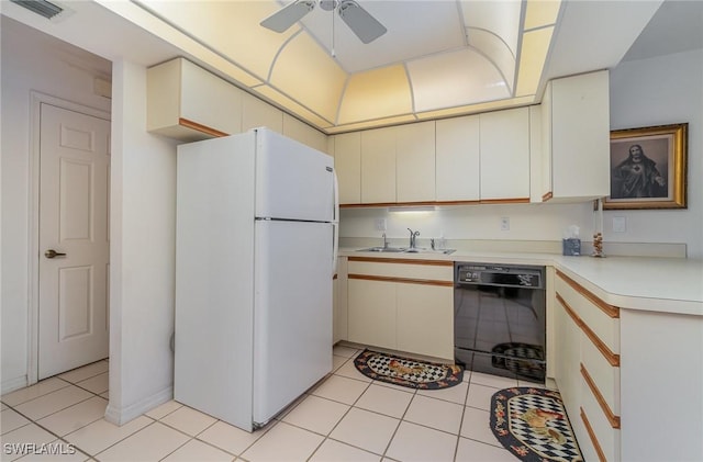 kitchen featuring ceiling fan, sink, black dishwasher, white refrigerator, and light tile patterned floors