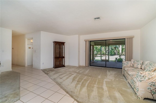 unfurnished living room featuring light tile patterned floors