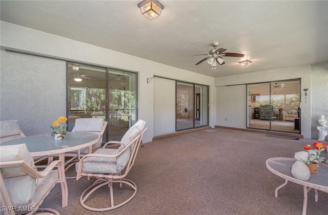 view of patio featuring ceiling fan