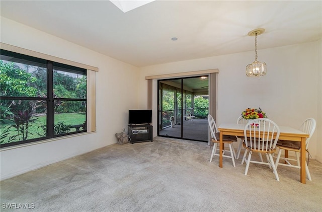 dining room featuring carpet floors and a healthy amount of sunlight