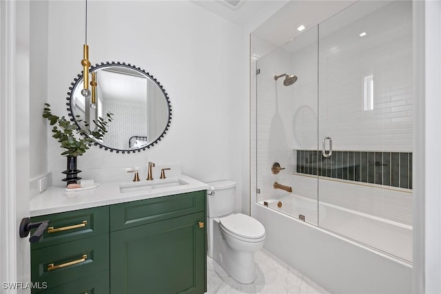 full bathroom featuring combined bath / shower with glass door, vanity, and toilet