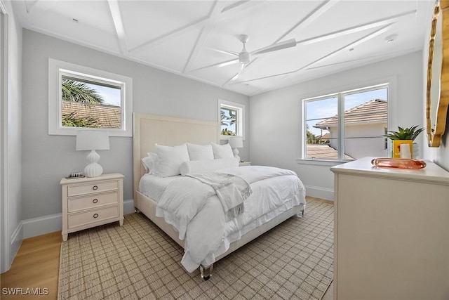 bedroom with ceiling fan and light hardwood / wood-style floors