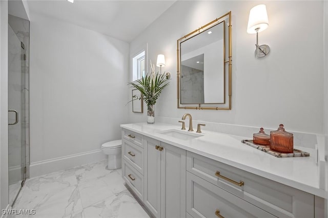 bathroom featuring vanity, toilet, and a shower with shower door