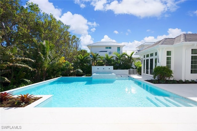 view of pool featuring french doors