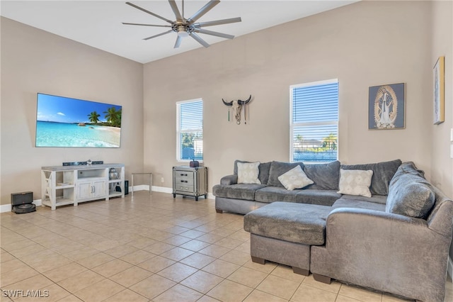 living room with light tile patterned floors and ceiling fan