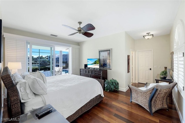 bedroom with ceiling fan, dark hardwood / wood-style flooring, and access to outside