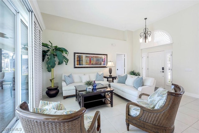 tiled living room featuring an inviting chandelier