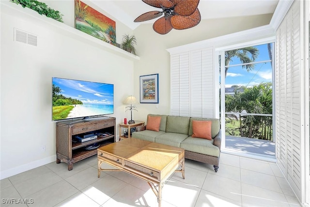 living room with light tile patterned floors, vaulted ceiling, and ceiling fan