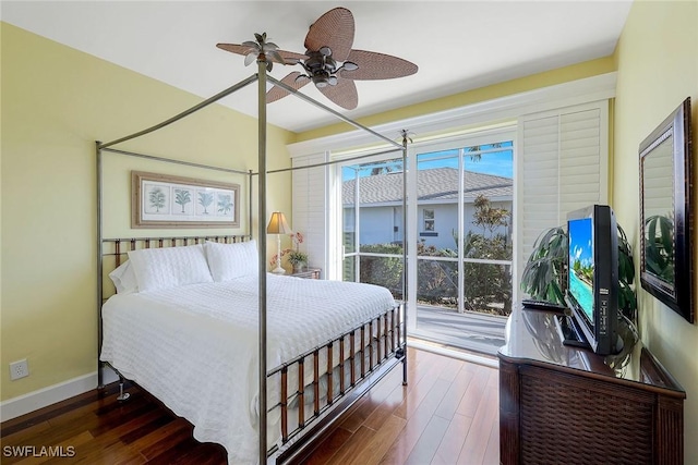 bedroom with access to outside, dark hardwood / wood-style floors, and ceiling fan