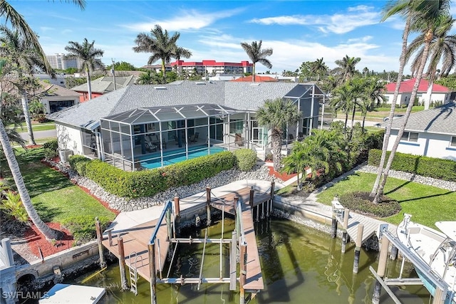 exterior space featuring glass enclosure and a water view