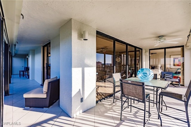 view of patio featuring ceiling fan