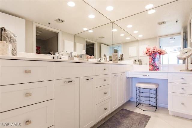 bathroom with tile patterned flooring and vanity