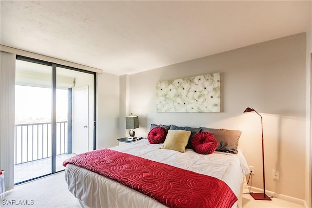 bedroom with access to exterior, light carpet, and floor to ceiling windows