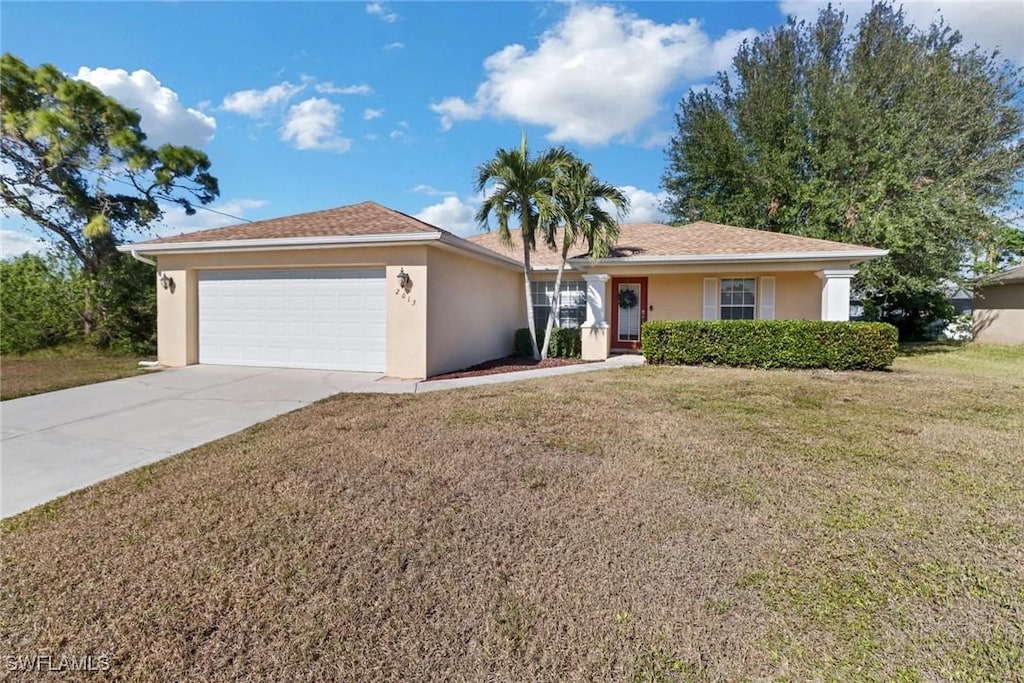 2013 NE 33rd Ln, Cape Coral, FL 33909 - ranch-style house featuring a front lawn and a garage