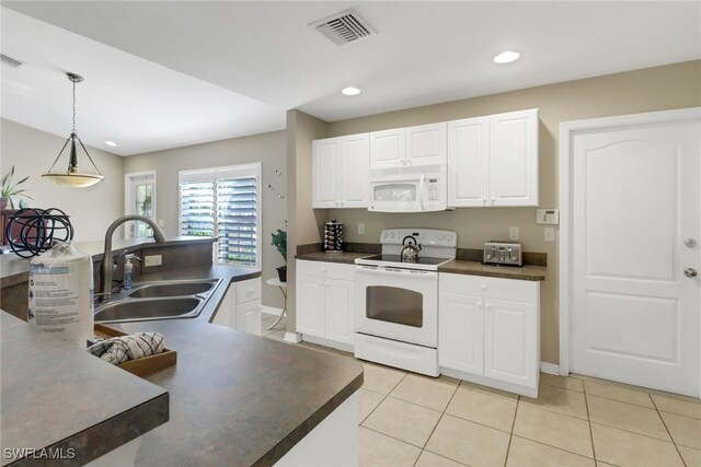 kitchen with pendant lighting, white appliances, white cabinets, sink, and light tile patterned flooring