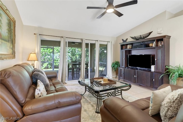 tiled living room with ceiling fan, a healthy amount of sunlight, and lofted ceiling