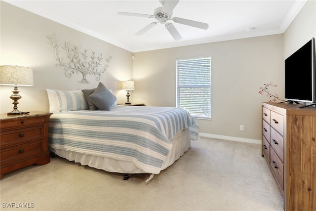 bedroom featuring ceiling fan, light colored carpet, and ornamental molding