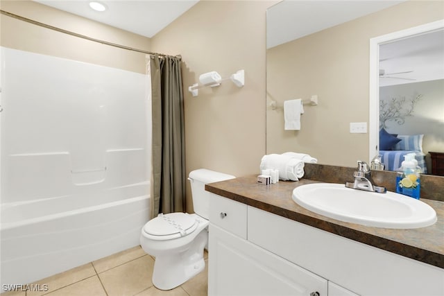 full bathroom featuring ceiling fan, tile patterned flooring, shower / bath combination with curtain, toilet, and vanity