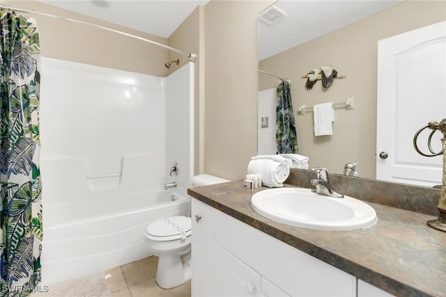 full bathroom featuring shower / bath combo with shower curtain, tile patterned flooring, vanity, and toilet