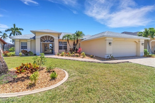 view of front of home featuring a garage and a front lawn