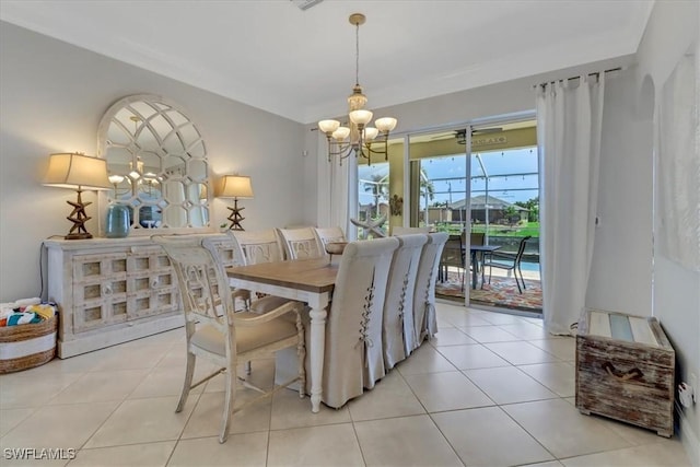 dining room with light tile patterned floors and a notable chandelier