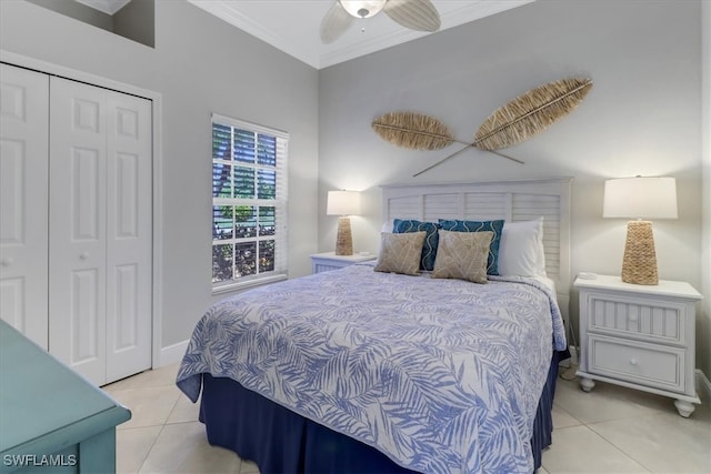 bedroom with crown molding, a closet, ceiling fan, and light tile patterned flooring