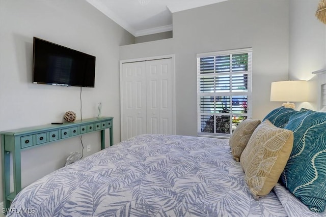 bedroom with crown molding and a closet