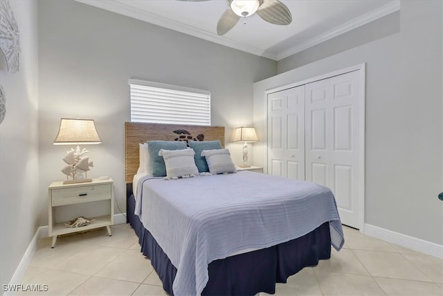 bedroom featuring tile patterned floors, a closet, ornamental molding, and ceiling fan