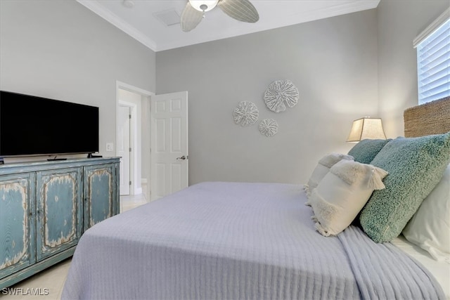 bedroom with ceiling fan and ornamental molding