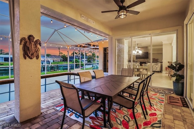 view of patio / terrace with glass enclosure and ceiling fan