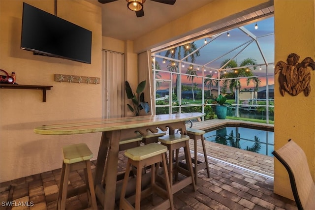 interior space with a pool and ceiling fan