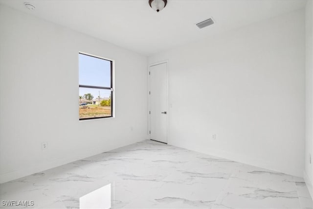 1436 Graham Cir, Lehigh Acres, FL 33936 - empty room featuring baseboards, visible vents, and marble finish floor