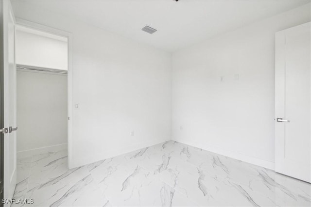 1436 Graham Cir, Lehigh Acres, FL 33936 - unfurnished bedroom with visible vents, baseboards, marble finish floor, and a closet