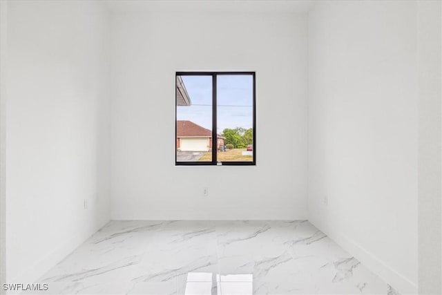 1436 Graham Cir, Lehigh Acres, FL 33936 - unfurnished room with marble finish floor and baseboards