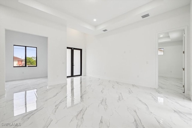 1436 Graham Cir, Lehigh Acres, FL 33936 - unfurnished room with marble finish floor, french doors, a tray ceiling, visible vents, and recessed lighting
