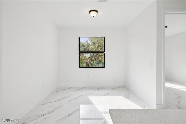 1436 Graham Cir, Lehigh Acres, FL 33936 - unfurnished room featuring marble finish floor and baseboards