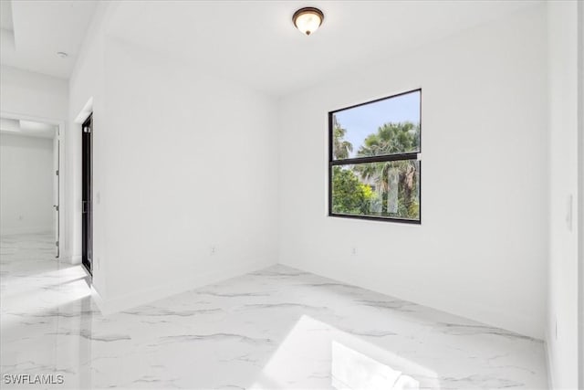 1436 Graham Cir, Lehigh Acres, FL 33936 - empty room with baseboards and marble finish floor