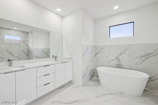 1436 Graham Cir, Lehigh Acres, FL 33936 - full bathroom with wainscoting, marble finish floor, a sink, and double vanity