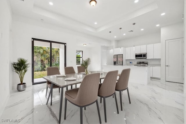 1436 Graham Cir, Lehigh Acres, FL 33936 - dining area featuring a tray ceiling, marble finish floor, and recessed lighting