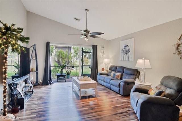 living room featuring ceiling fan, hardwood / wood-style floors, and vaulted ceiling