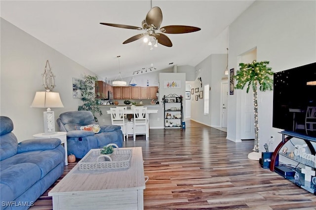 living room with dark hardwood / wood-style flooring, high vaulted ceiling, and ceiling fan