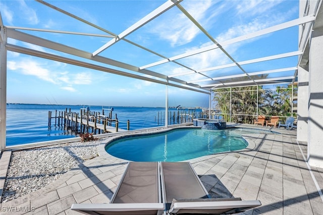 view of pool with a water view, a patio area, a dock, and a lanai