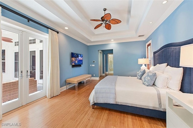 bedroom with access to outside, french doors, a raised ceiling, ceiling fan, and light hardwood / wood-style floors