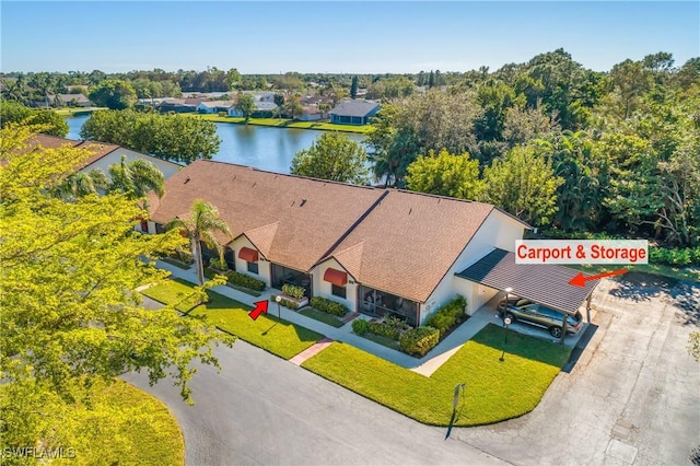 birds eye view of property with a water view