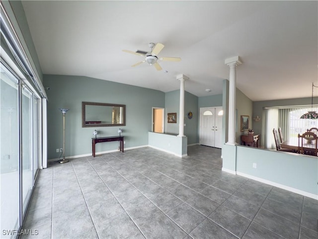 unfurnished living room with tile patterned floors, ornate columns, ceiling fan, and lofted ceiling