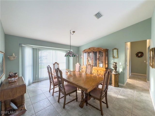 dining space with light tile patterned floors