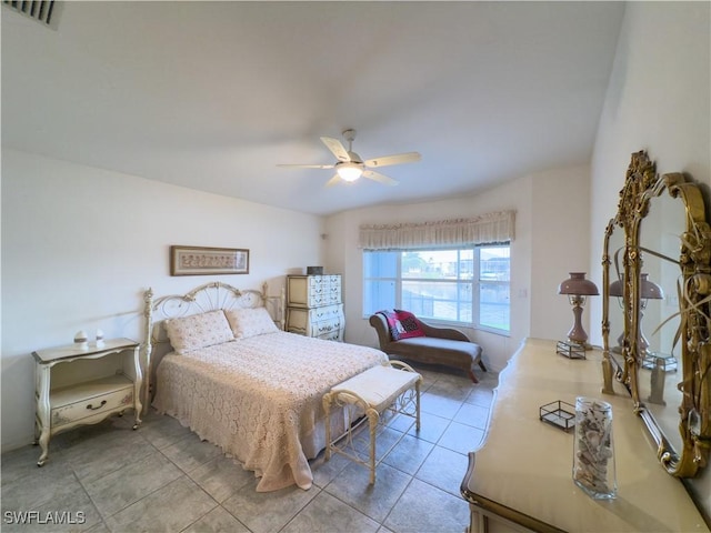 tiled bedroom with ceiling fan