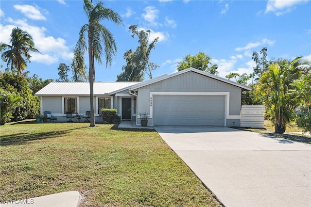 single story home featuring a front yard and a garage